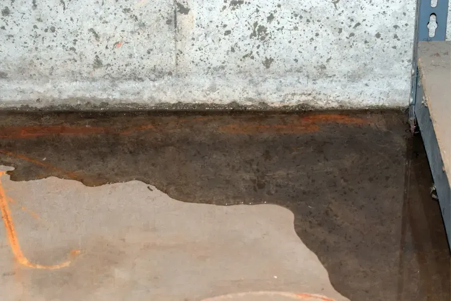 Wet concrete slab where a leak under the floor surfaced in a Lodi home
