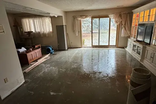 Standing water across the floor of a Lodi living room before extraction